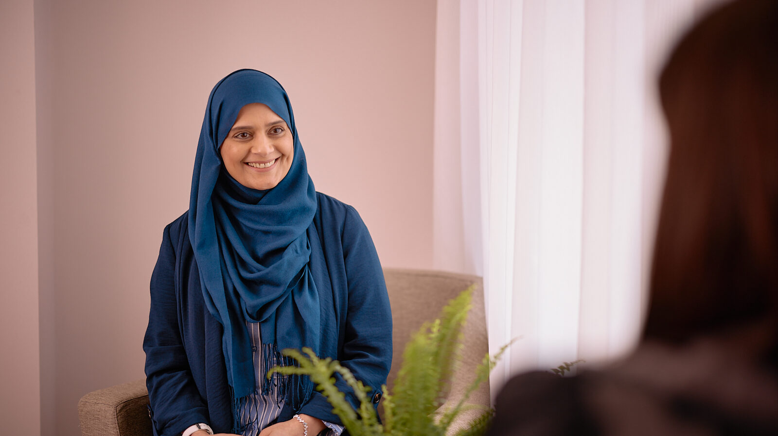 Therapist seeing patient in one-to-one session