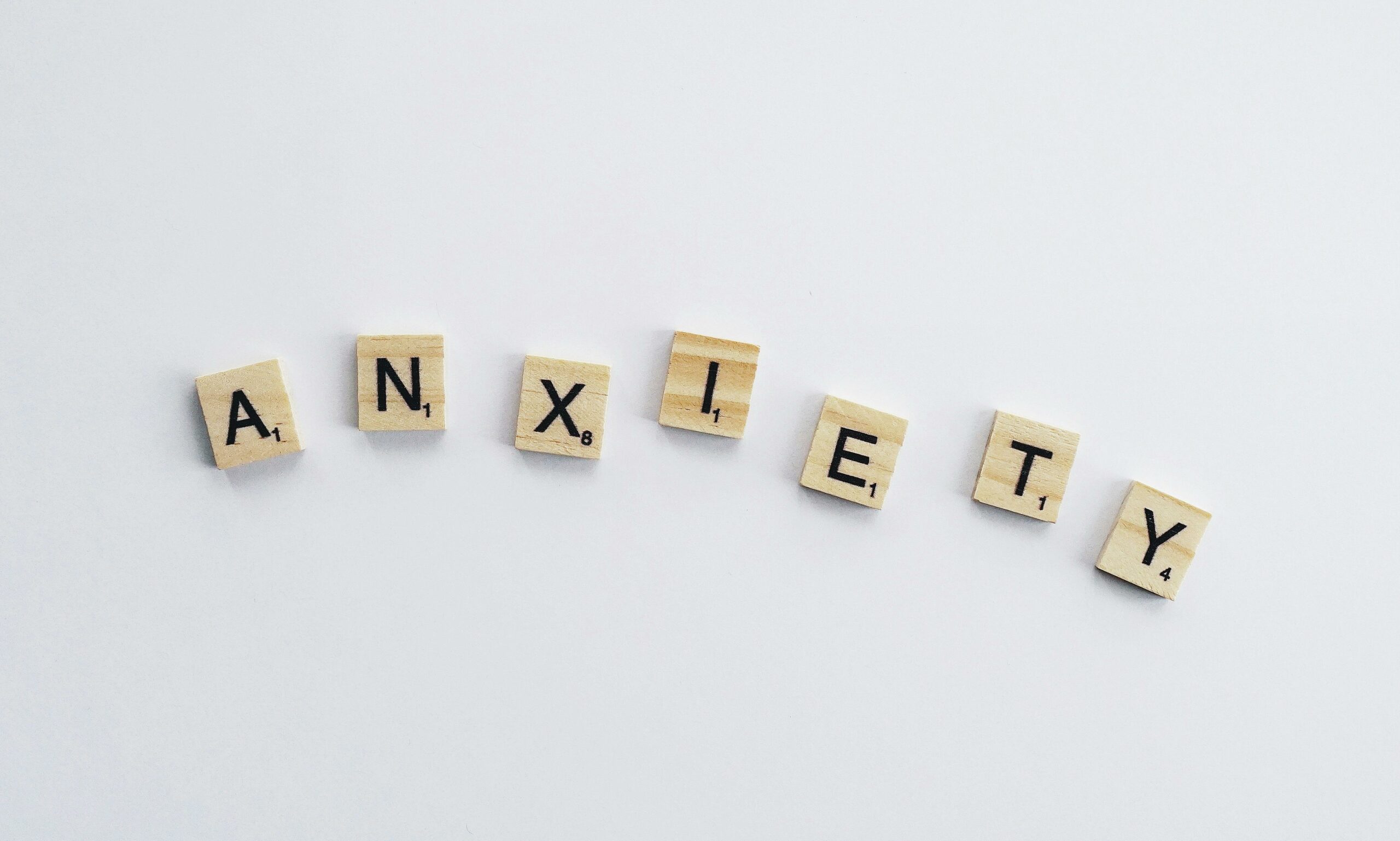 Letter tiles that spell out anxiety